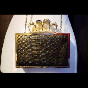 Kate Landry brass knuckles clutch